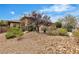 A landscaped front yard enhances the curb appeal of this home at 7505 Java Sparrow St, North Las Vegas, NV 89084