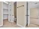 Hallway with tile floor, leading to a bathroom and bedroom at 7505 Java Sparrow St, North Las Vegas, NV 89084