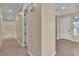 Hallway with white doors and tile flooring at 7505 Java Sparrow St, North Las Vegas, NV 89084