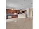 Open-concept kitchen with dark cabinets, stainless steel appliances, and a spacious layout at 7505 Java Sparrow St, North Las Vegas, NV 89084