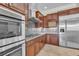 Gourmet kitchen boasts stainless steel appliances and custom cabinets at 7505 Java Sparrow St, North Las Vegas, NV 89084