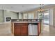 Kitchen island features stainless steel appliances and custom cabinets at 7505 Java Sparrow St, North Las Vegas, NV 89084