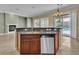 Open concept kitchen features a breakfast bar, stainless steel appliances and views of the backyard at 7505 Java Sparrow St, North Las Vegas, NV 89084