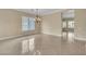 The living room has tile floors, a chandelier, and large windows at 7505 Java Sparrow St, North Las Vegas, NV 89084