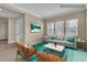A beautifully staged living room with modern furnishings and a neutral color palette creates a serene atmosphere at 7505 Java Sparrow St, North Las Vegas, NV 89084