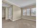 Bright and airy room featuring tiled floors, neutral walls, and abundant natural light at 7505 Java Sparrow St, North Las Vegas, NV 89084