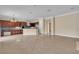 Open-concept living space with tile flooring, connecting the kitchen and living areas at 7505 Java Sparrow St, North Las Vegas, NV 89084