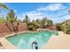 The pool features a built-in spa and offers beautiful views of the mature landscaping at 7505 Java Sparrow St, North Las Vegas, NV 89084