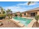 Backyard pool with stone surround and rock landscaping at 7505 Java Sparrow St, North Las Vegas, NV 89084
