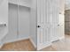 Walk-in closet with built-in shelving and closet rod for clothing storage at 7505 Java Sparrow St, North Las Vegas, NV 89084