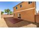 Low-maintenance backyard with gravel, concrete patio, and block wall offers a private outdoor area at 7609 Aubusson Ct, Las Vegas, NV 89149
