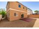 View of the low-maintenance backyard featuring a concrete patio, gravel, and block wall at 7609 Aubusson Ct, Las Vegas, NV 89149