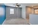 Carpeted bedroom with neutral walls, a ceiling fan, and good natural light at 7609 Aubusson Ct, Las Vegas, NV 89149