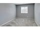 Neutral bedroom featuring carpet and a window for a light and airy space at 7609 Aubusson Ct, Las Vegas, NV 89149