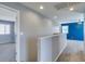 Upstairs hallway with view into bedroom and laundry area at 7609 Aubusson Ct, Las Vegas, NV 89149