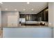 Stylish kitchen featuring granite countertops, stainless steel appliances, and dark wood cabinets at 7609 Aubusson Ct, Las Vegas, NV 89149