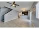 Spacious living room featuring open concept, tile flooring, neutral paint and kitchen access at 7609 Aubusson Ct, Las Vegas, NV 89149