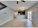 Bright living room with open floor plan, tile flooring, and sliding glass doors to outdoor space at 7609 Aubusson Ct, Las Vegas, NV 89149