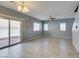 Bright living area featuring tile floors and access to the backyard through sliding doors at 7609 Aubusson Ct, Las Vegas, NV 89149