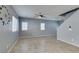 Spacious living room featuring open concept, tile flooring, neutral paint and a large clock at 7609 Aubusson Ct, Las Vegas, NV 89149