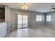 Bright living area with modern decor, tile floors, and access to the backyard through sliding doors at 7609 Aubusson Ct, Las Vegas, NV 89149
