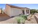 Charming backyard featuring desert landscaping, covered patio, and low-maintenance gravel at 7669 Fieldfare Dr, North Las Vegas, NV 89084