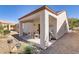 Outdoor covered patio featuring desert landscaping, perfect for outdoor relaxation and activities at 7669 Fieldfare Dr, North Las Vegas, NV 89084