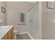 Modern bathroom featuring a glass enclosed shower with brushed-metal fixtures and towel bar at 7669 Fieldfare Dr, North Las Vegas, NV 89084