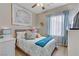 Comfortable bedroom with a beach-themed decor and soft lighting at 7669 Fieldfare Dr, North Las Vegas, NV 89084