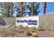 Welcoming entrance to Sun City Aliante community with lush desert landscaping and a decorative sign at 7669 Fieldfare Dr, North Las Vegas, NV 89084