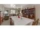 Open dining and living room featuring a bookcase and comfortable seating area at 7669 Fieldfare Dr, North Las Vegas, NV 89084