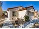 Attractive single-story home with desert landscaping, and a convenient two-car garage at 7669 Fieldfare Dr, North Las Vegas, NV 89084
