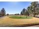 Scenic golf course view with lush green fairways and mature trees in a tranquil setting at 7669 Fieldfare Dr, North Las Vegas, NV 89084