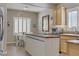 Well-lit kitchen featuring a wood island, stainless steel appliances, and plantation shutters at 7669 Fieldfare Dr, North Las Vegas, NV 89084