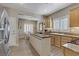 Bright kitchen with a wood-topped island, stainless steel appliances, and light wood cabinetry at 7669 Fieldfare Dr, North Las Vegas, NV 89084