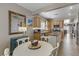 Kitchen and dining area with lots of cabinets, island and seating for four people at 7669 Fieldfare Dr, North Las Vegas, NV 89084