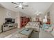 Spacious living room showcases a cozy seating arrangement, entertainment center, and inviting decor at 7669 Fieldfare Dr, North Las Vegas, NV 89084