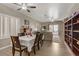 Open concept dining and living room area featuring sliding glass doors and built-in shelving at 7669 Fieldfare Dr, North Las Vegas, NV 89084
