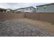Backyard featuring a stone-paved patio and gravel landscaping at 7672 Lush Oasis Ave, Las Vegas, NV 89113