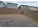 Backyard featuring a stone-paved patio and low-maintenance gravel landscaping at 7672 Lush Oasis Ave, Las Vegas, NV 89113