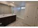 Bathroom with double sink vanity and bathtub at 7672 Lush Oasis Ave, Las Vegas, NV 89113