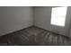 Cozy bedroom featuring neutral carpeting and a window for natural light at 7672 Lush Oasis Ave, Las Vegas, NV 89113