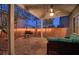 Enjoy this covered patio complete with outdoor seating, grill, and ambient string lights at 7728 Whispering River St, Las Vegas, NV 89131
