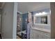 Charming bathroom featuring a walk-in shower, neutral color palette, and a modern vanity at 7728 Whispering River St, Las Vegas, NV 89131