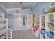 Well-organized bedroom features multiple doors, ample shelving, and soft carpeting at 7728 Whispering River St, Las Vegas, NV 89131