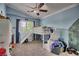 Bright bedroom features a built-in loft bed with slide, soft carpet, and ceiling fan at 7728 Whispering River St, Las Vegas, NV 89131