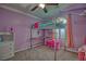 Charming bedroom featuring a loft bed, soft carpet, and whimsical decor at 7728 Whispering River St, Las Vegas, NV 89131