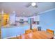 Kitchen and dining area with stainless steel appliances, granite counters, and white cabinets at 7728 Whispering River St, Las Vegas, NV 89131