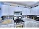 Updated kitchen featuring stainless steel appliances, stylish countertops, and ample cabinet space at 7728 Whispering River St, Las Vegas, NV 89131