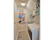 Functional laundry room with updated appliances, practical storage, and tile flooring at 7728 Whispering River St, Las Vegas, NV 89131